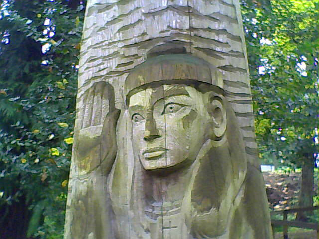 Taken at St. Dunstan's church in Seattle. The saint's likeness carved on a log, totem pole style.